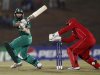 South Africa's Hashim Amla plays a shot next to Zimbabwe's captain and wicketkeeper Brendan Taylor during their Twenty20 World Cup cricket match in Hambantota