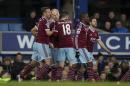 West Ham United's James Collins, second left, celebrates with teammates after scoring against Everton during their English FA Cup third round soccer match at Goodison Park Stadium, Liverpool, England, Tuesday Jan. 6, 2015. (AP Photo/Jon Super)