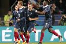 France's Antoine Griezmann, left, celebrates with his teammates the equalizer during a friendly soccer match France against Albania at Route de Lorient stadium in Rennes, western France, Friday, Nov. 14, 2014. The match ended in a 1-1 draw. (AP Photo/Michel Euler)