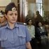 Tolokonnikova, Samutsevich and Alyokhina, members of female punk band "Pussy Riot", attend their trial inside the defendant's cell in a court in Moscow