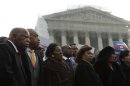 U.S. Rep. John Lewis (D-GA) and Rev. Al Sharpton attend a voter's rights rally in front of the U.S. Supreme Court in Washington