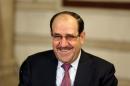 Iraq's Vice President and former Prime Minister Nouri al-Maliki, smiles during an interview with The Associated Press in Baghdad, Iraq, Monday, Feb. 2, 2015. Al-Maliki denies he is seeking a political comeback despite frequent appearances in local media and a recent high-profile visit to influential neighboring Iran. (AP Photo/Khalid Mohammed)