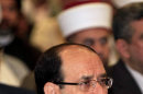 Iraqi Prime Minister Nouri al-Maliki attends the Convergence of religions conference in Baghdad, Iraq, Saturday, April 27, 2013. Gunmen killed 10 people in Iraq, including five soldiers near the main Sunni protest camp west of Baghdad, the latest in a wave of violence that has raised fears the country faces a new round of sectarian bloodshed. The attack on the army intelligence soldiers in the former insurgent stronghold of Ramadi drew a quick response from al-Maliki, whose Shiite-led government has been the target of rising Sunni anger over perceived mistreatment.(AP Photo/Karim Kadim)