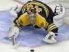 Boston Bruins goalie Tuukka Rask drops to the ice for the puck, against the Pittsburgh Penguins during the second period in Game 3 of the NHL hockey Stanley Cup playoffs Eastern Conference finals, in Boston on Wednesday, June 5, 2013. (AP Photo/Charles Krupa)