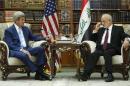 Iraq Foreign Minister Ibrahim al-Jaafari, right, receives Secretary of State John Kerry in the library at the foreign minister's villa in Baghdad, Friday, April 8, 2016. (Jonathan Ernst/Pool Photo via AP)