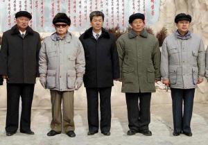 North Korean leader Kim Jong-Il (2nd L) posing with …