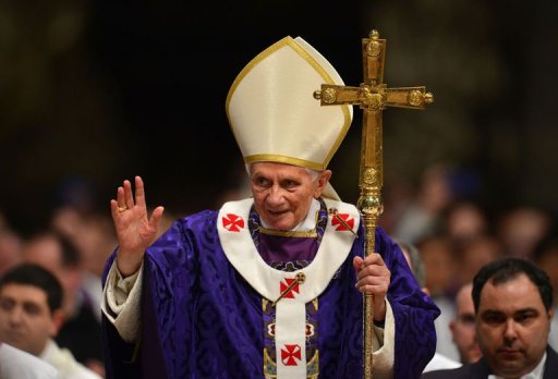 Pope Benedict XVI waves as he leaves after celebrating Mass on February 13, 2013 at St Peter's basilica at the Vatican