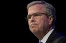 FILE - In this Feb. 4, 2015 file photo, former Florida Gov. Jeb Bush pauses while speaking at a Economic Club of Detroit in Detroit. Running for president as part of a family dynasty is presenting former Florida Gov. Jeb Bush with inevitable comparisons he must address as he moves closer to a campaign for the White House. "I recognize that as a result, my views will often be held up in comparison to theirs," Bush says, referring to his brother, former President George W. Bush and his father, former President George H. W. Bush, in excerpts released early of a midday speech he's to give in Chicago Wednesday. (AP Photo/Paul Sancya, File)