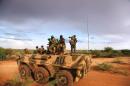This handout photo released by the African Union-United Nations Information Support Team (AU-UN IST) shows AU troops standing on top of an APC on the outskirts of Burubow in the Gedo region of Somalia on March 14, 2014