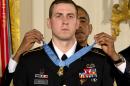 President Barack Obama bestows former Army Staff Sergeant Ryan M. Pitts with the Medal of Honor in the East Room of the White House Monday, July 21, 2014, in Washington. Pitts is the ninth living recipient of the nation's highest decoration for battlefield valor for actions in Iraq and Afghanistan. (AP Photo/Jacquelyn Martin)
