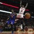 Chicago Bulls' Nate Robinson loses the ball as he goes to the basket against New York Knicks' J.R. Smith during the second half of their NBA game in Chicago