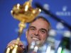 Paul McGinley of Ireland smiles near the Ryder Cup during a news conference after being named the European Ryder Cup captain at the St. Regis in Saadiyat Islands in Abu Dhabi