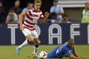 Holden of the U.S. moves the ball away from Honduras' Lopez during their CONCACAF Gold Cup soccer match in Arlington