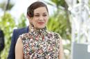 Actress Marion Cotillard arrives for a photo call for Two Days, One Night (Deux jours, une nuit) at the 67th international film festival, Cannes, southern France, Tuesday, May 20, 2014. (AP Photo/Alastair Grant)