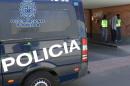 Spanish anti-terror police arrest a suspected Islamic State sympathiser in San Martin de la Vega, on August 25, 2015