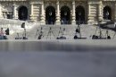 Reporters' tripods are left in position in front of Italy's supreme court building in Rome