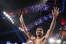Manny Pacquiao of the Philippines acknowledges the crowd just after his unanimous decision victory over Timothy Bradley during their WBO World Welterweight championship boxing match, Saturday, April 12, 2014, at The MGM Grand Garden Arena in Las Vegas. (AP Photo/Eric Jamison)
