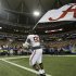 Alabama defensive lineman Quinton Dial (90) runs on the field with a Alabama flag after their 32-28 win in the Southeastern Conference championship NCAA college football game against Georgia, Saturday, Dec. 1, 2012, in Atlanta. (AP Photo/David Goldman)