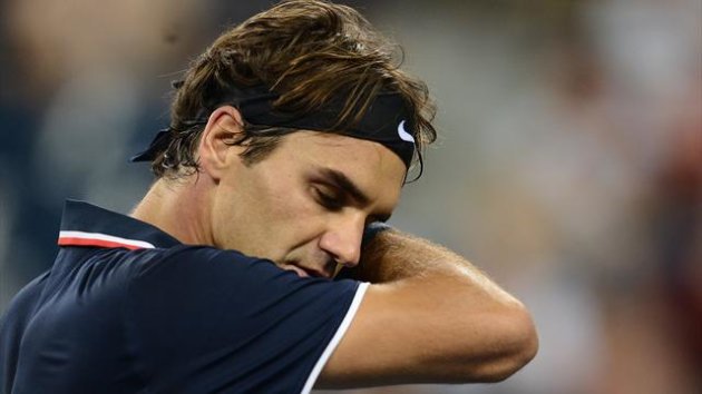 'Wounded' Federer wants break from tennis