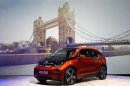 The new BMW i3 electric car is unveiled in front of a projected image of Tower Bridge at a ceremony in London