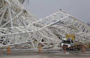 A collapsed metal structure sits on the ground at Itaquerao …