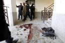 Blood stains and flak jackets used by attackers remain in the hallway of a dormitory where a militant attack took place, at Bacha Khan University in Charsadda