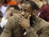 Miami Heat's LeBron James watches from the bench in the third quarter of an NBA basketball game against the Cleveland Cavaliers Monday, April 15, 2013, in Cleveland. James did not dress in Miami's 96-95 win. (AP Photo/Mark Duncan)