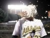 Oakland Athletics' Brandon Moss gets a shaving cream pie to the face as he conducts an interview after his game winning two-run home run against the Los Angeles Angels during a baseball game on Tuesday, April 30, 2013 in Oakland. Calif. Oakland won 10-8 in 19 innings.  (AP Photo/Marcio Jose Sanchez)