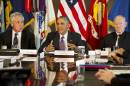 President Barack Obama, flanked by Defense Secretary Chuck Hagel, left, and Joint Chiefs Chairman Gen. Martin Dempsey, speaks to the media at the conclusion of a meeting with senior military leadership, Wednesday, Oct. 8, 2014, at the Pentagon. (AP Photo/Jacquelyn Martin)