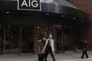 A man exits the AIG headquarters offices in New York's financial district