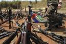 A Central African Republic flag is seen on a gun, which is diplayed among other arms confiscated from ex-Seleka rebels and "anti-balaka" militia by the French military of Operation Sangaris at a French military base in Bangui