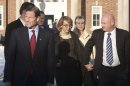 U.S. Senator Blumenthal, former U.S. Representative Giffords and her husband, former astronaut Kelly, leave the Newtown Municipal Building in Newtown,
