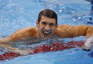 Michael Phelps of the U.S. smiles after winning the men's 4x200m freestyle relay final during the London 2012 Olympic Games at the Aquatics Centre July 31, 2012. Phelps won a record 19th Olympic medal on Tuesday when he joined forces with his U.S. team mates to win the 4x200 metres freestyle relay at London's Aquatic Centre. REUTERS/Toby Melville