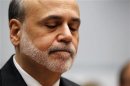 Ben Bernanke reacts as he testifies before the House Committee on the Financial Services semi-annual monetary policy report on Capitol Hill in Washington