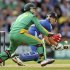 England's Trott hits the ball past South Africa's de Villiers during the third one-day international cricket match at the Kia Oval cricket ground in London