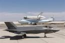 Lockheed Martin F-35 JSF is pictured with space shuttle Endeavour mounted atop its 747 SCA at 461st FLTS JSF Integrated Test Force at Edwards Air Force Base, California