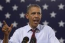 President Barack Obama campaigns Saturday, Aug. 18, 2012, in Windham, N.H., at Windham High School. (AP Photo/Carolyn Kaster)