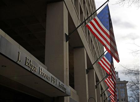 The main headquarters of the FBI, the J. Edgar Hoover Building, is seen in Washington in this file photo taken March 4, 2012. The FBI's move to replace its cramped, crumbling and outmoded downtown headquarters has sparked a cross-border fight among local governments in Virginia, Maryland and the capital. Eager for the FBI's prestige and a plum deal in a slumping real estate market, local officials are plotting strategies and lining up congressional support to try to land the project. REUTERS/Gary Cameron/Files