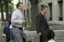 Former Major League baseball pitcher Roger Clemens, left, and his legal team, arrive at federal court in Washington, Wednesday, May 30, 2012. (AP Photo/Susan Walsh)
