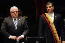 President Rafael Correa (R) stands next to Fernando Cordero, then president of the National Assembly, in Quito on August 10, 2011