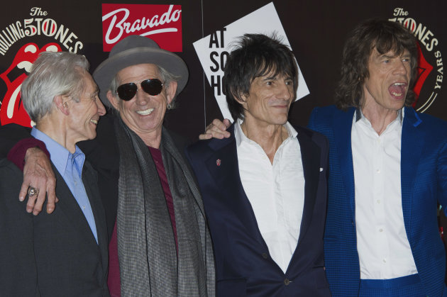 FILE -This Thursday, July 12, 2012 file photo shows, from left, Charlie Watts, Keith Richards, Ronnie Wood and Mick Jagger, from the British Rock band, The Rolling Stones, as they arrive at a central London venue, to mark the 50th anniversary of the Rolling Stones first performance. The legendary band said Monday it would return to the stage this year with four concerts in New York and London. The shows mark the first time in five years at the Stones have performed live, with Mick Jagger, Keith Richards, Charlie Watts and Ronnie Wood all coming together once more. (AP Photo/Jonathan Short)