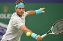 Juan Martin Del Potro of Argentina hits a return to Nicolas Almagro of Spain during their quarter-final match in the Shanghai Masters tennis tournament in Shanghai on October 11, 2013