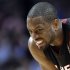 Miami Heat guard Dwyane Wade reacts as he watches a free throw by Chicago Bulls forward Luol Deng during the second half of an NBA basketball game in Chicago on Wednesday, March 27, 2013. The Bulls won 101-97, ending the Heat's 27-game winning streak. (AP Photo/Nam Y. Huh)