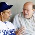 File photo of Los Angeles Dodgers head coach Torre talking to Garagiola Sr. before playing the Chicago White Sox in a MLB spring training game in Glendale