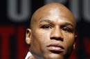 FILE - In this April 2010, file photo, Floyd Mayweather Jr. poses for a photo during a news conference in Las Vegas. Promoter Bob Arum said Wednesday, Jan. 14, 2015, that Manny Pacquiao has agreed to all terms for what would be boxing's richest fight ever, a bout with Mayweather Jr. that fans have been demanding for five years. (AP Photo/Isaac Brekken, File)