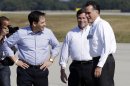 Republican presidential candidate and former Massachusetts Gov. Mitt Romney is greeted by Rep. Connie Mack, R-Fla., and Sen. Marco Rubio, R-Fla., left, as he steps off his plane to attend campaign events in Pensacola, Fla., Saturday, Oct. 27, 2012. (AP Photo/Charles Dharapak)