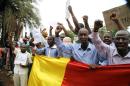 Malian people take part in a demonstration in front of the French Ambassy in Bamako on May 19, 2014, to denounce the occupation by rebels of Kidal