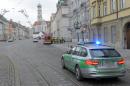 Police and paramedics are seen during a mass evacuation on December 25, 2016 on the empty streets of Augsburg, southern Germany