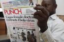 A man reads a local newspaper with headline news about a Lagos female doctor contracts Ebola Virus, in Lagos, Nigeria, Tuesday, Aug. 5, 2014. Lagos State Health Commissioner Jide Idris announced Tuesday that eight people are being kept in quarantine with symptoms of Ebola. (AP Photo/Sunday Alamba)