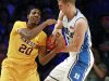 Duke forward Mason Plumlee (5) and Minnesota guard Austin Hollins (20) fight for a loose ball in the first half of an NCAA college basketball game at the Battle 4 Atlantis tournament, Thursday, Nov. 22, 2012, in Paradise Island, Bahamas. (AP Photo/John Bazemore)